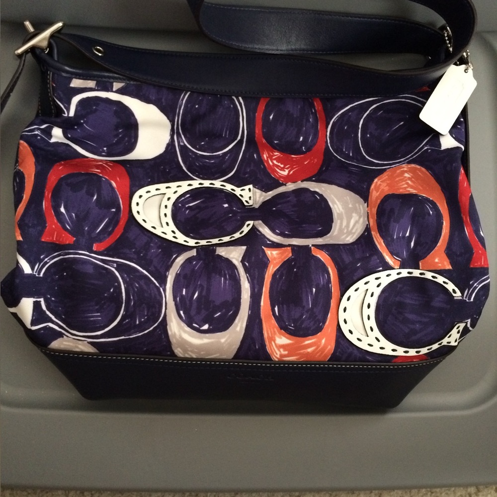 Coach cloth/leather purse. Has spots on the bottom in the leather. See photos - Picture 1 of 4